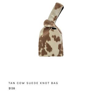 Tan cow print Yaito handle bag.